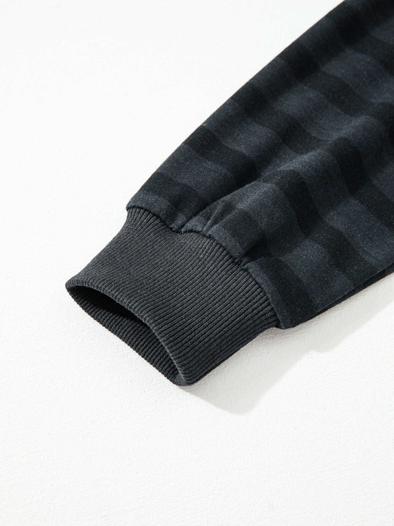 Dark gray striped pajama sleeve cuff detail