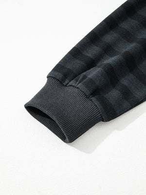 Dark gray striped pajama sleeve cuff detail