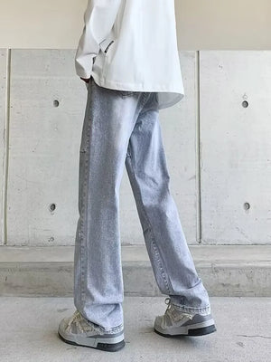 Men's light wash wide-leg jeans with vintage detailing.