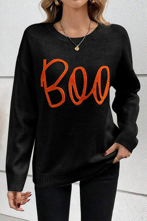 Black crewneck sweater with orange "Boo" appliqué detail