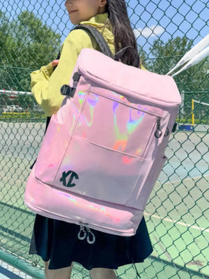 Spacious pink travel bag with iridescent panel and buckle closure.