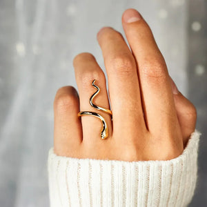 Gold finish serpentine coil ring with a bypass design, artfully sculpted into a snake.