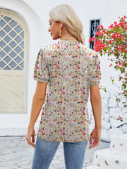 Floral print blouse with short sleeves and a keyhole neckline, shown from the back.