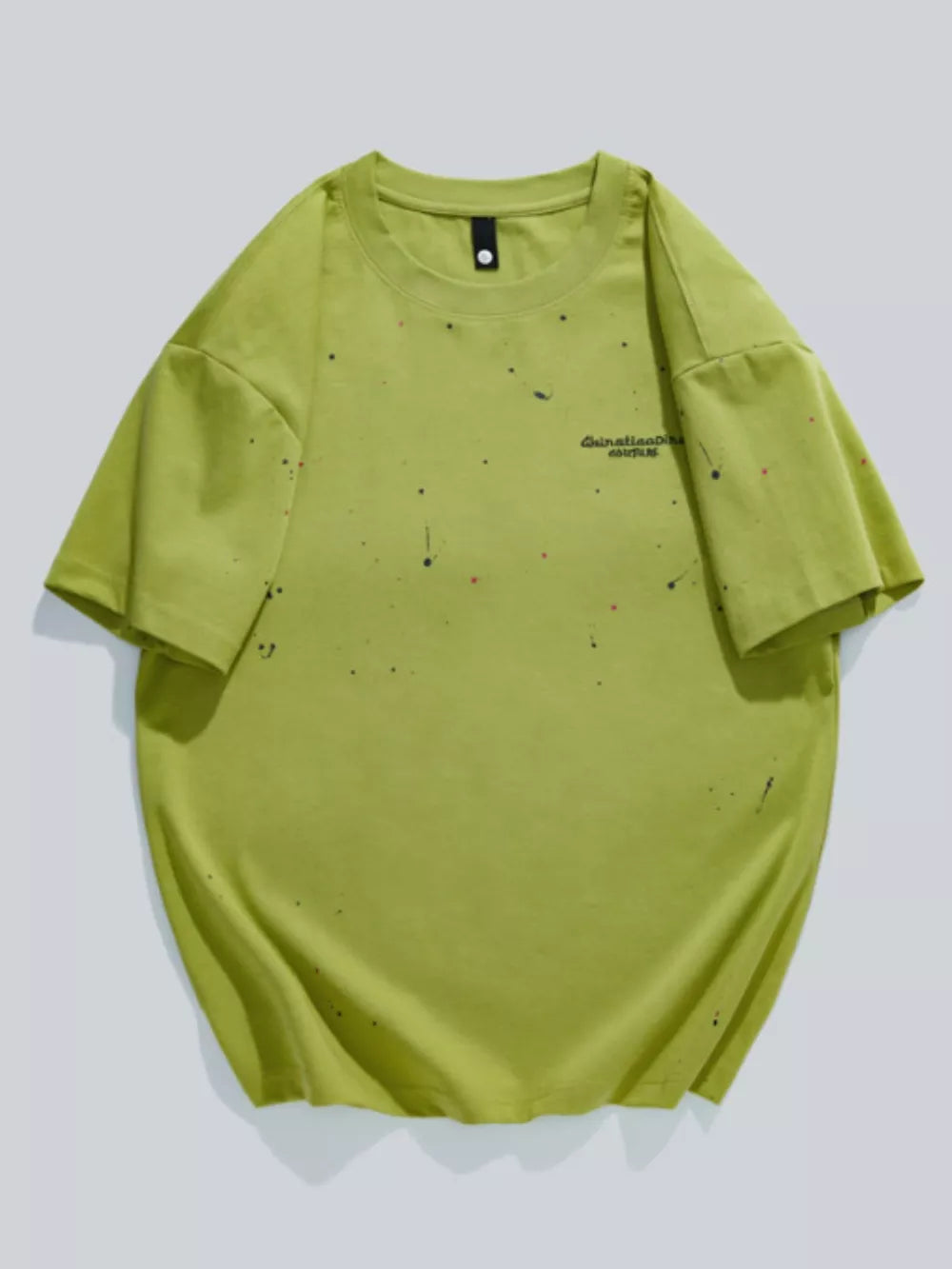 Fluorescent green cotton t-shirt with artistic paint splatter detail and graphic text.