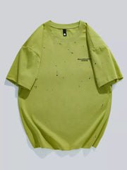 Fluorescent green cotton t-shirt with artistic paint splatter detail and graphic text.