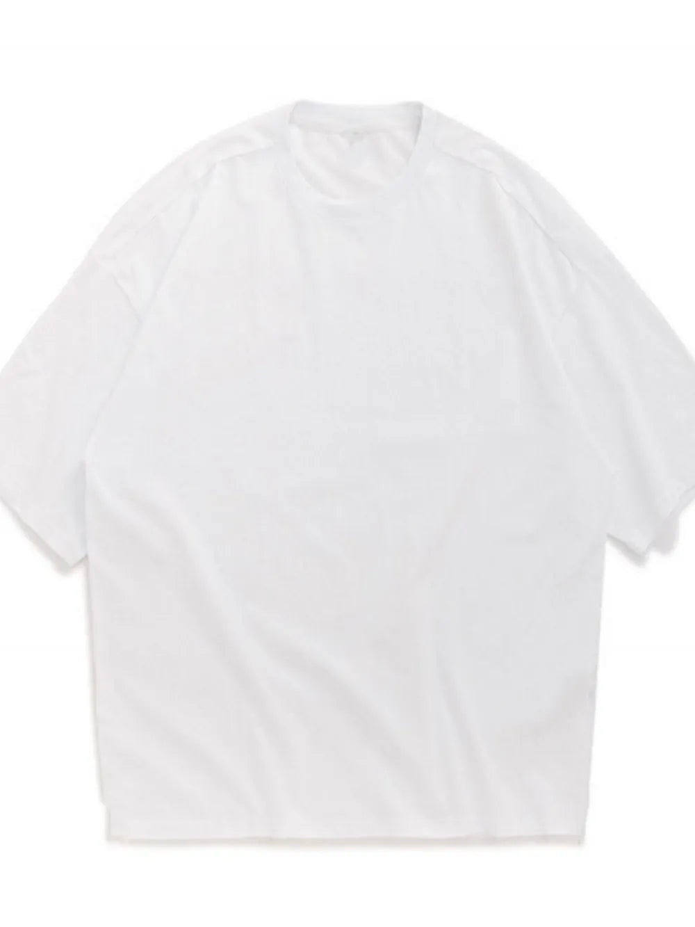 Oversized white crew neck t-shirt with textured fabric and short sleeves.