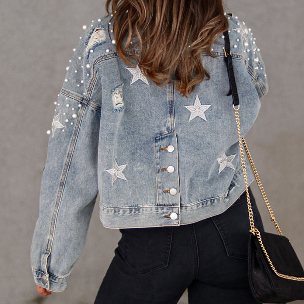 Light denim jacket with pearl embellishments and star patches, distressed details.