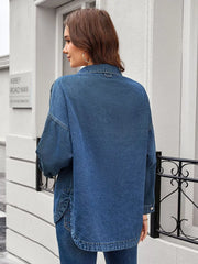 Denim trucker jacket in blue wash with button-down front and chest pockets.