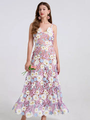 Embroidered floral maxi dress in purple with appliqué flowers and lace detail.