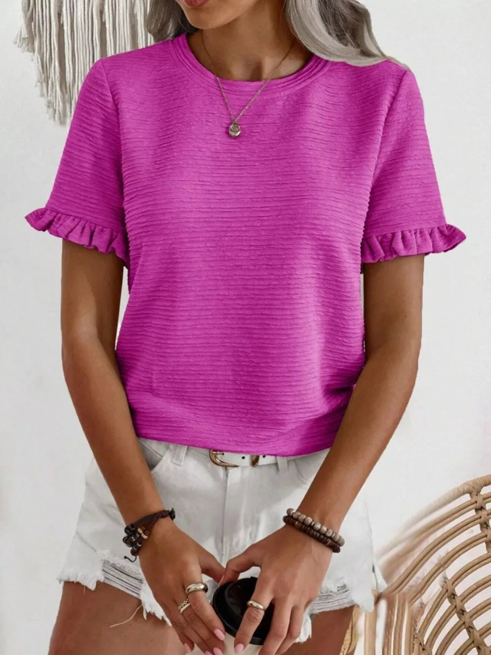 Textured ruffle sleeve t-shirt in purple with a crew neck and short sleeves.