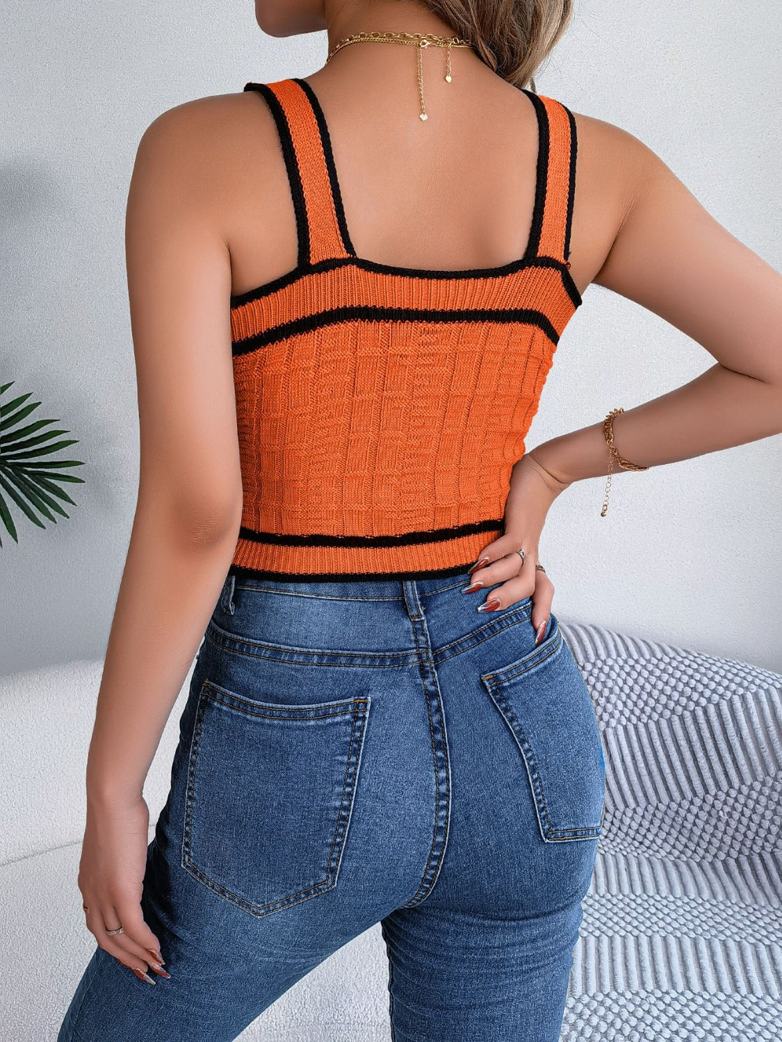 Orange textured knit tank top with black contrast trim and square neckline