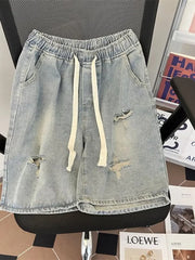 Light blue distressed denim shorts with drawstring and raw hem