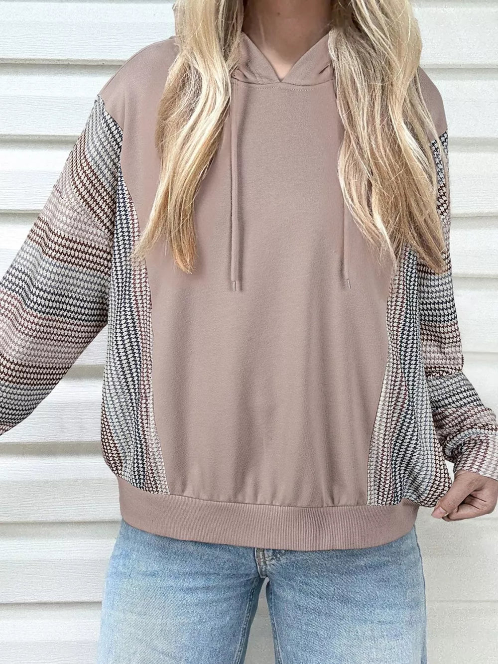 Relaxed fit cotton hoodie with multi-tonal patterned sleeves and a drawstring hood.