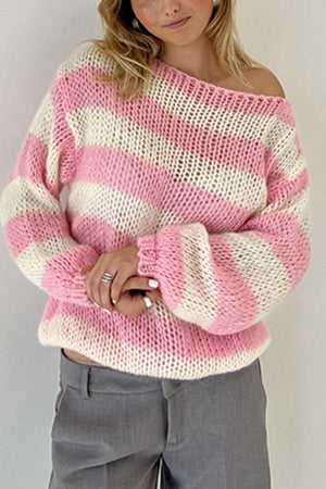 Off-shoulder striped knit sweater with voluminous sleeves in blush pink and white.