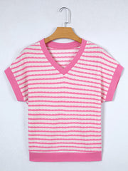 Textured pink and white striped V-neck t-shirt with short sleeves and pink trim.