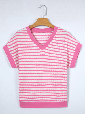 Textured pink and white striped V-neck t-shirt with short sleeves and pink trim.