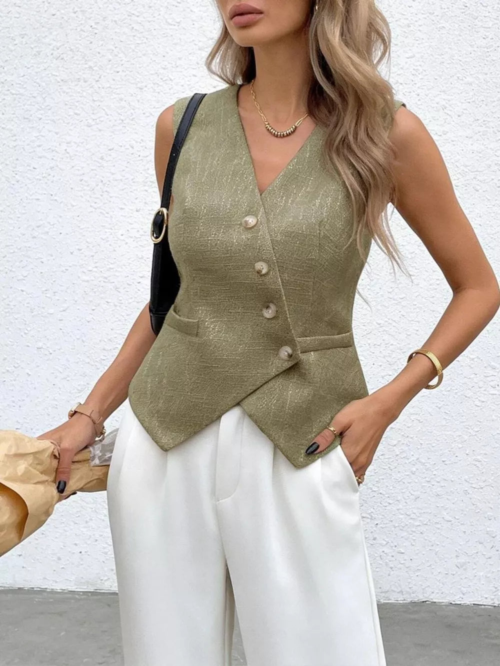 Yellow-green asymmetrical V-neck buttoned vest with textured fabric and pocket detail.