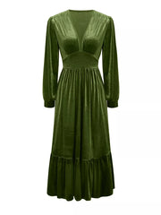Elegant dark green velvet maxi dress with voluminous sleeves and ruffled hem