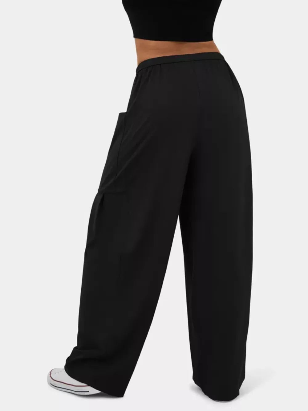 Black wide-leg jeggings with cargo pocket detail and drawstring waist.