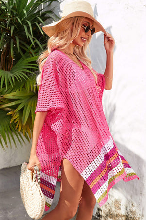 Rose pink crochet cover-up with rainbow hemline, V-neck, and short sleeves.
