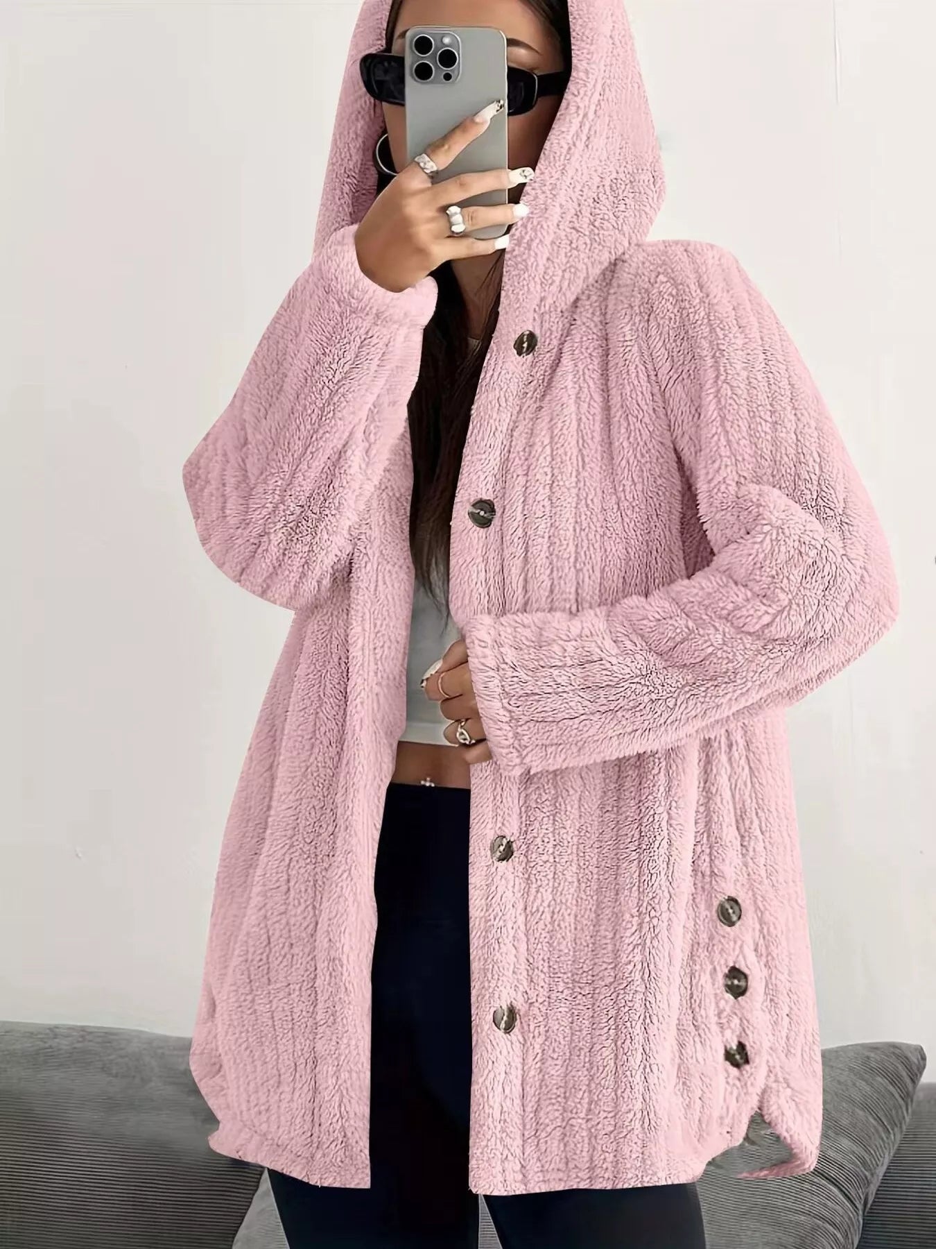 Pink button-up fleece jacket with hood and textured fabric