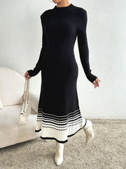 Black ribbed knit midi dress with contrast striped hem and long sleeves.