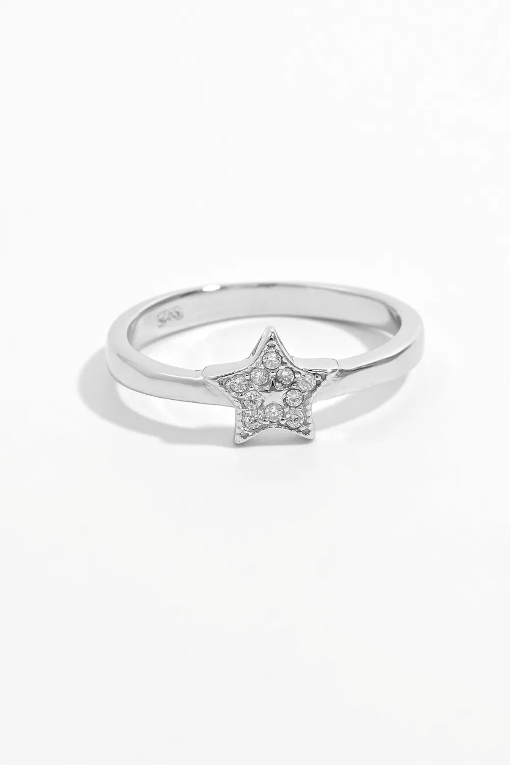 Silver ring with a diamond-studded star design
