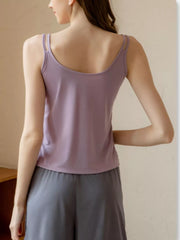 Lilac camisole with double spaghetti straps and a draped neckline.