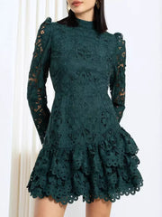 Dark green lace mock neck mini dress with ruffled tiered skirt and puff sleeves.