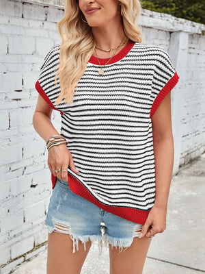 Textured stripe knit top with cap sleeves and red trim, styled with denim shorts.