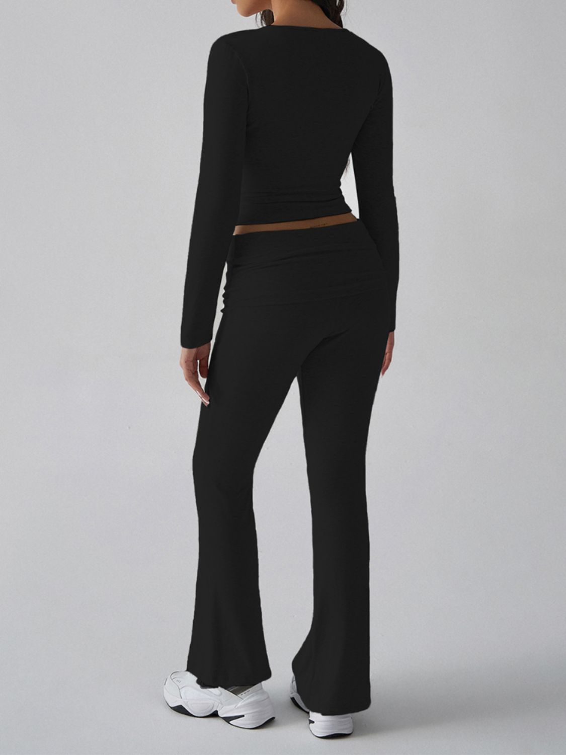 Black long sleeve loungewear set with square neckline and flared pants.