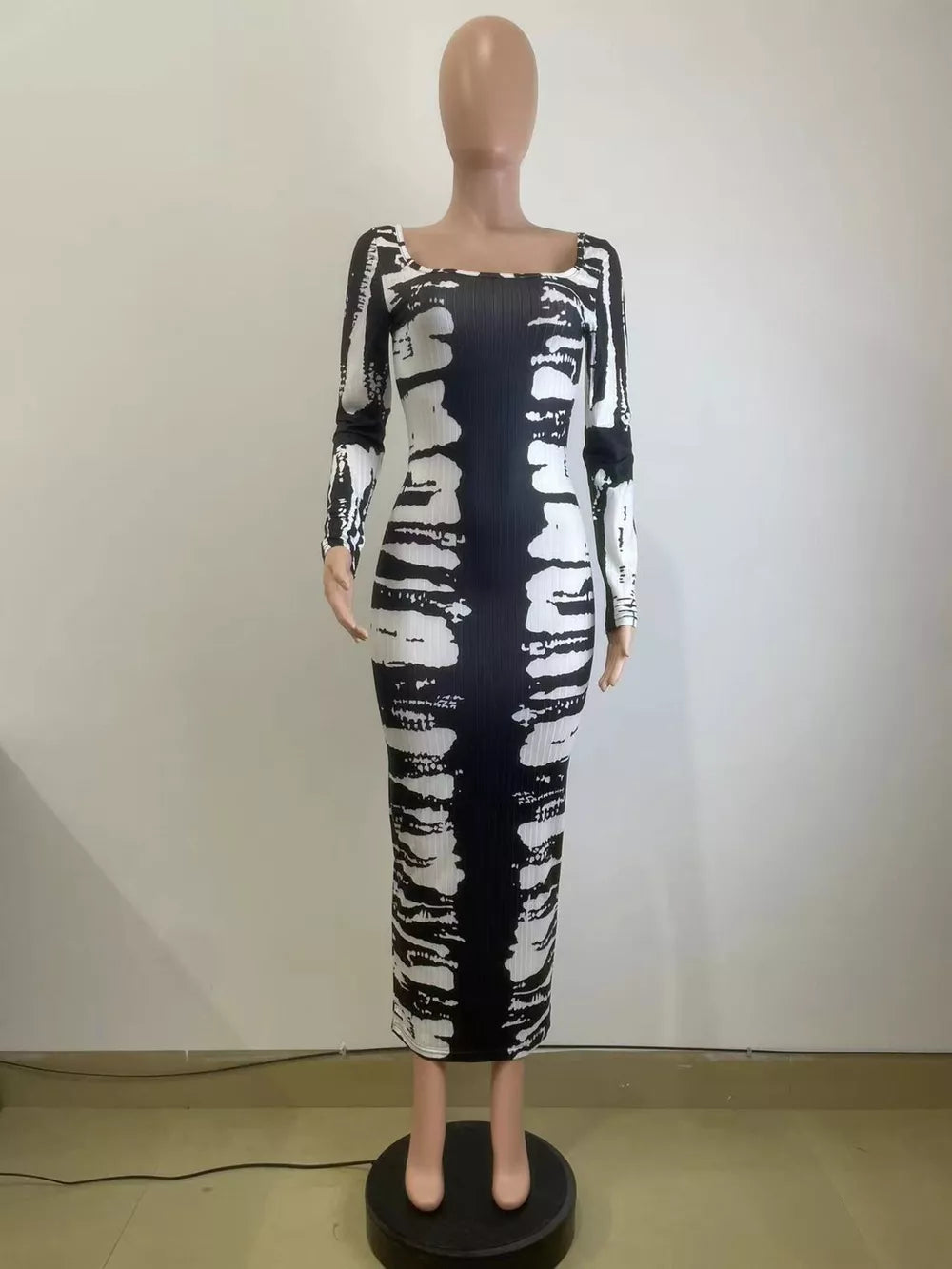 Black and white tie-dye maxi dress with long sleeves and square neckline.