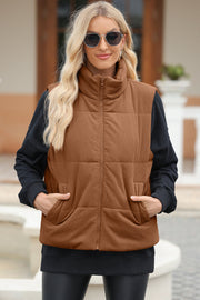Brown corduroy padded funnel neck vest with zip front and pockets.