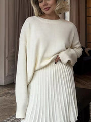 White soft knit sweater with ribbed detailing and crew neck.