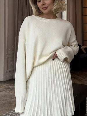 White soft knit sweater with ribbed detailing and crew neck.