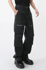 Dark denim wide-leg cargo pants with zip pockets and flap pockets.