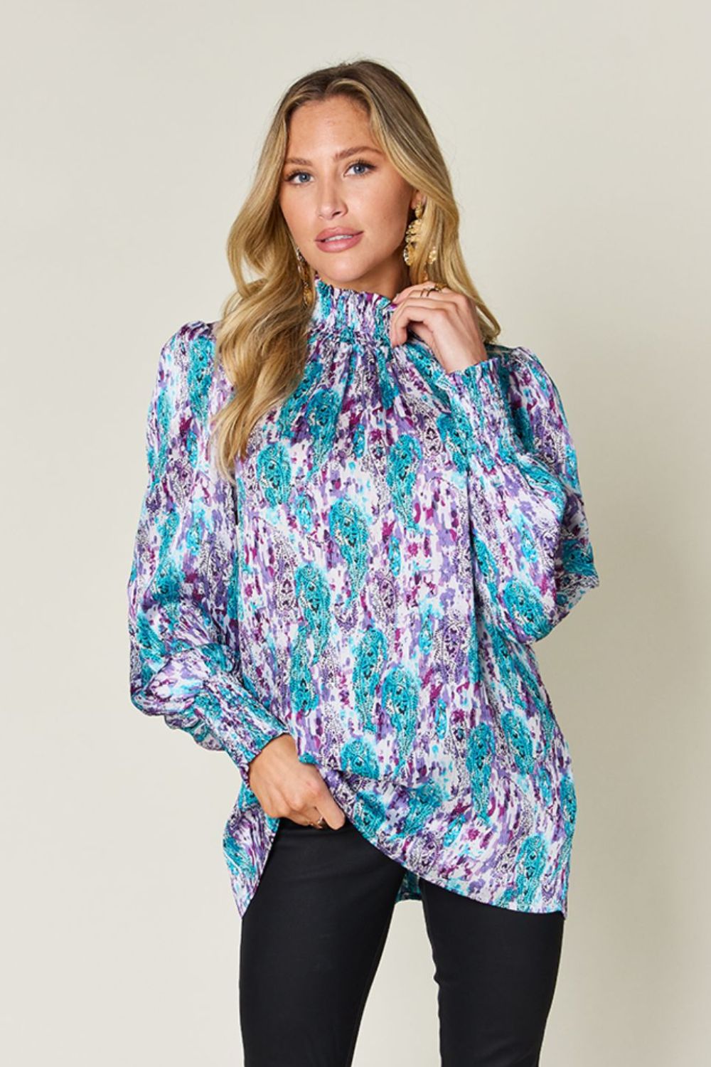 High neck abstract print blouse in sky blue and red-violet with long sleeves.