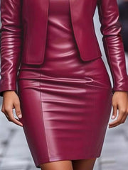 Burgundy leather jacket dress set with fitted skirt and long sleeves.