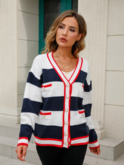 Navy and white striped knit cardigan with pearl buttons and red trim.