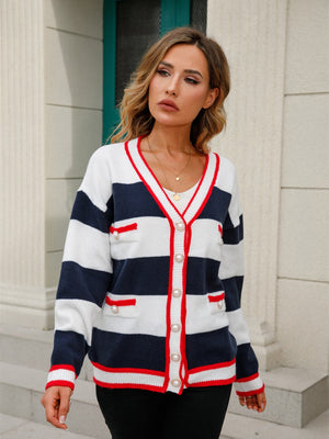 Navy and white striped knit cardigan with pearl buttons and red trim.