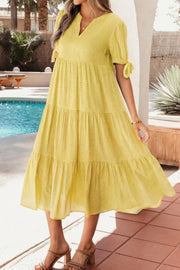 Yellow gingham midi dress with tie sleeves and tiered skirt
