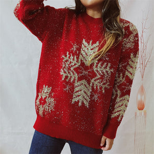 Red acrylic knit sweater with gold snowflake embellishments and metallic threads.