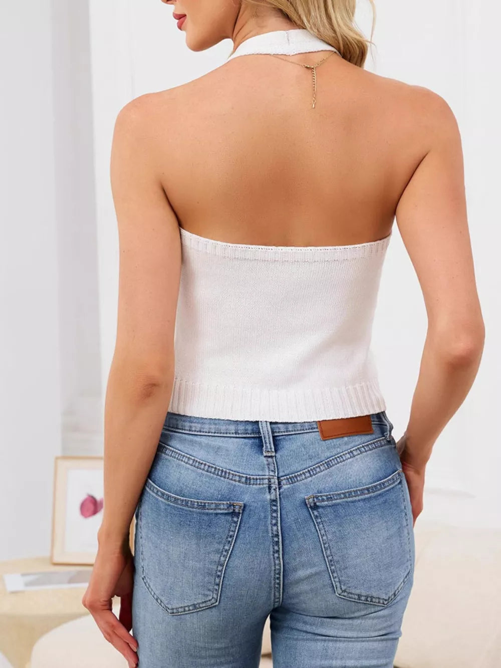 White halter neck knit vest with button detail, cropped length, polyester