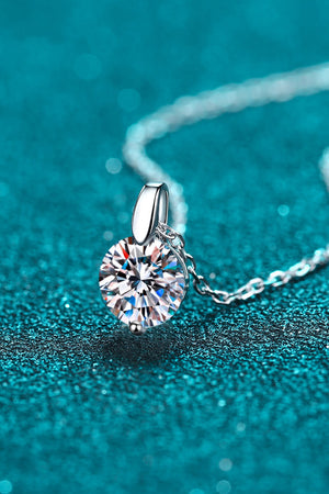 Silver solitaire moissanite pendant necklace with a round brilliant cut stone.