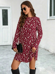 Deep Red floral swing mini dress with long sleeves and a round neckline.