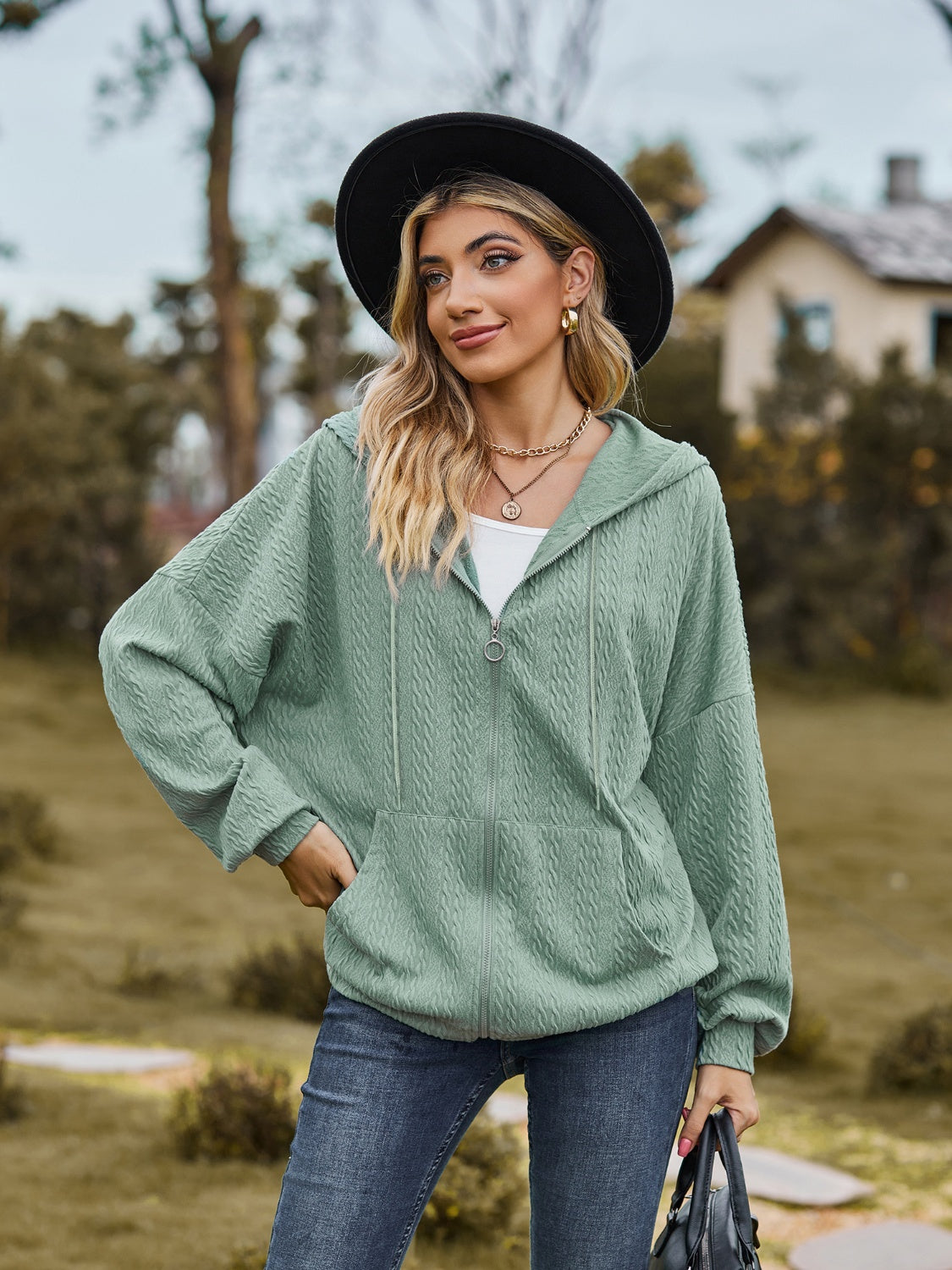 Sage green textured knit dolman sleeve zip-up hoodie with front pocket and drawstring hood.