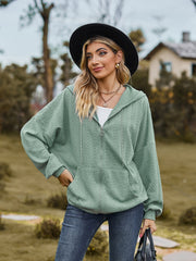 Sage green textured knit dolman sleeve zip-up hoodie with front pocket and drawstring hood.