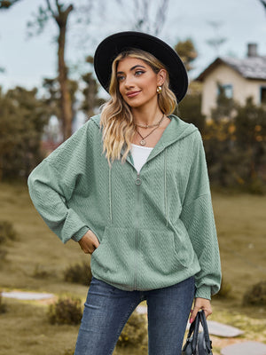 Sage green textured knit dolman sleeve zip-up hoodie with front pocket and drawstring hood.