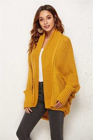 Textured cocoon knit cardigan in gold with batwing sleeves and open front.