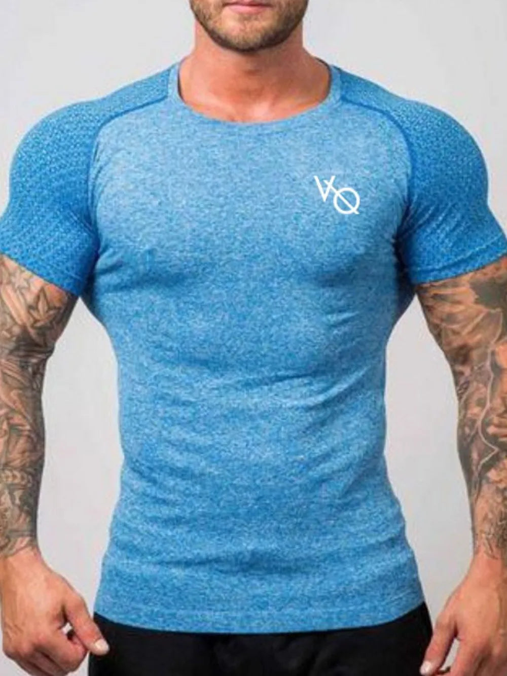 Sky blue performance raglan tee with white logo and textured sleeves.